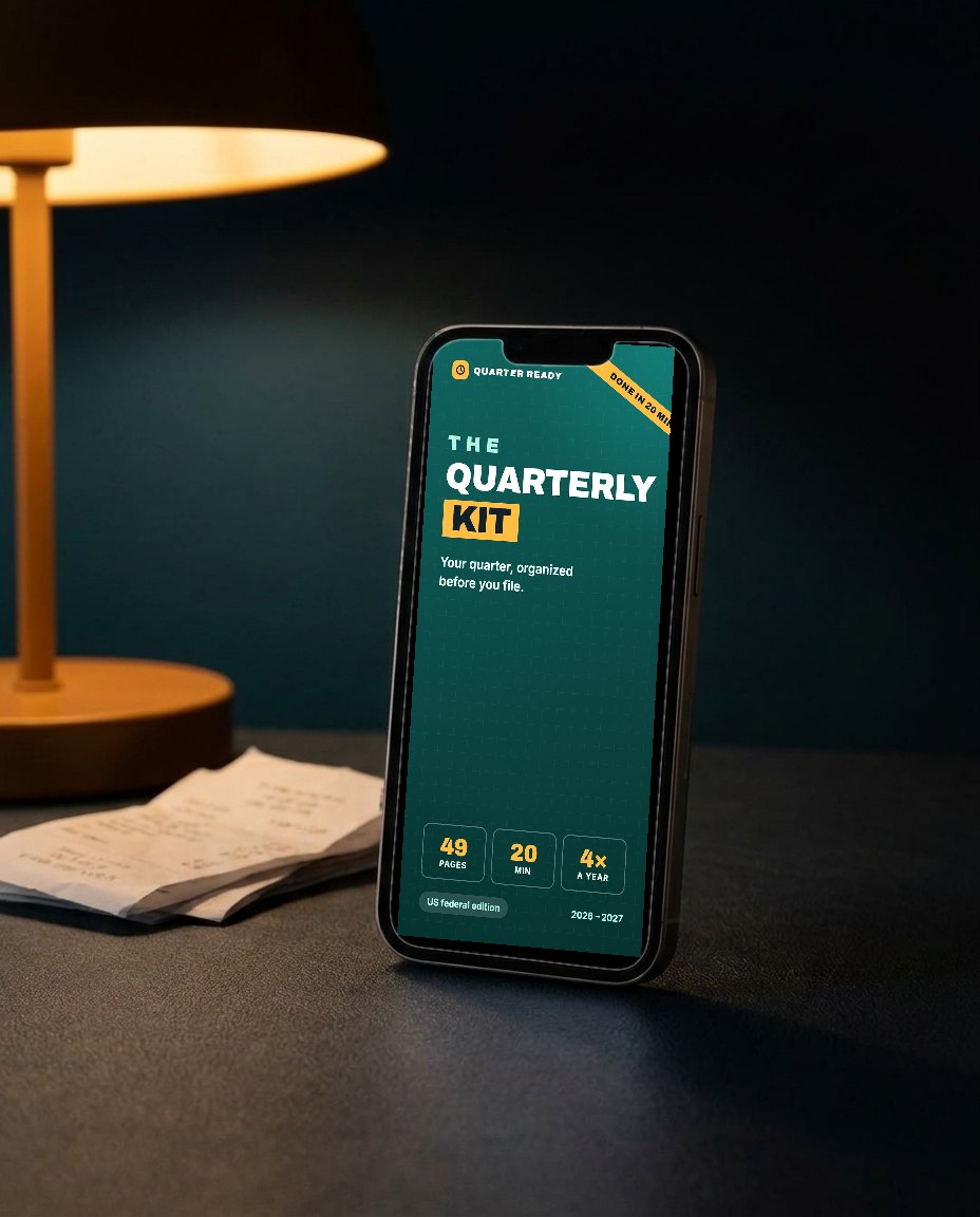 The Quarterly Kit, open on a phone on a desk at night